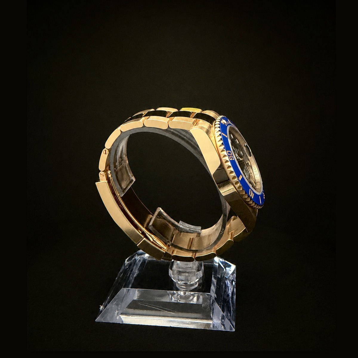 Rolex Submariner 126618LB opposite side profile showing 18k yellow gold case and blue ceramic bezel